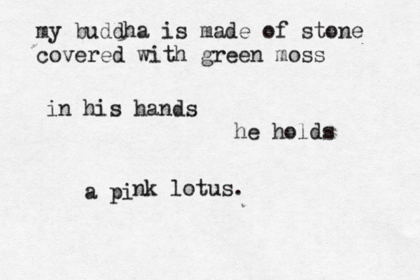 my buddha is made of stone covered with green moss in his hands he holds a pi nk lotus. 