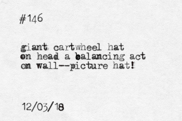 #146 giant cartwheel hat on head a c b balancing act on wall--picture hat! 12/03/18