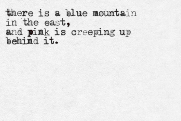 there is a blue mountain in the east, and pink is creeping up behind it.