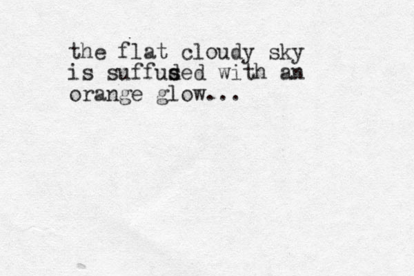 the flat cloudy sky is suffud sed s with an orange glow... 