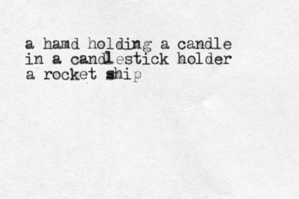 a hamd holding a candle in a candlestick holder a rocket ship
