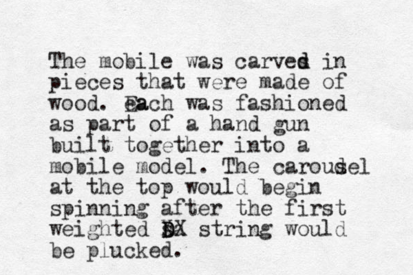 The mobile was carves d d in pieces that were made of wood. ea Each was fashioned as part of a hand gun built together into a mobile model. The caroud sel at the top would begin spinning after the first weighted s D Da XX string would be plucked. 