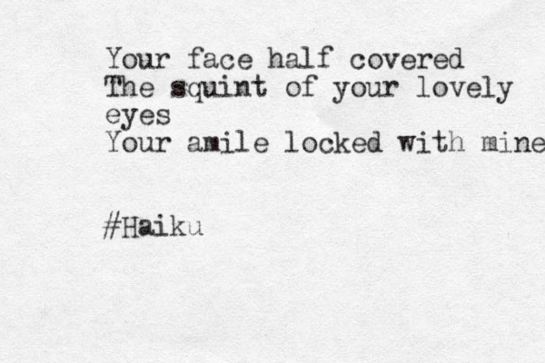 Your face half covered The squint of your lovely eyes Your amile locked with mine #Haiku