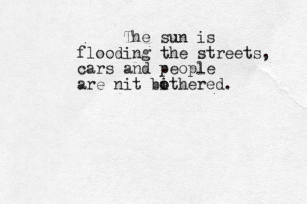 The sun is flooding the streets, cars and people are nit bithered o o .
