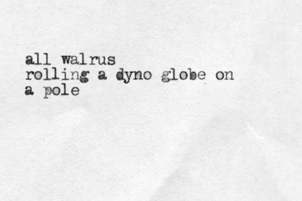all walrus rolling a dyno globe on a pole