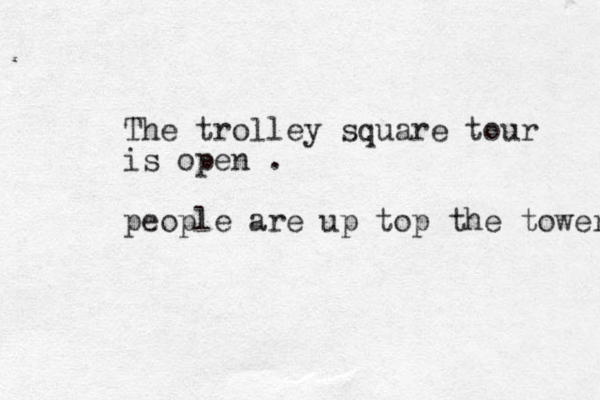 The trolley square tour is open . people are up top the tower 