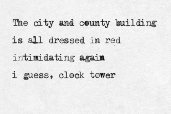The city and county building is all dressed in red intimidating again i guess, clock tower