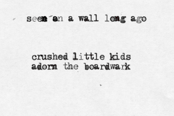 seee n n a on a wall long ago crushed little kids adorn the boardwark 